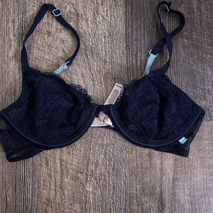 VS unpadded navy bra with lace and flower design